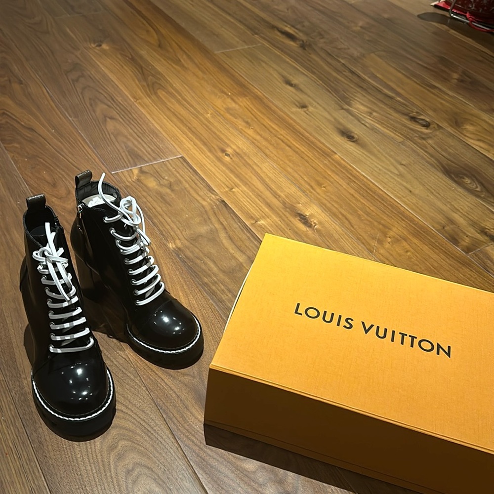 Brand new 100 % Louis Vuitton booties with box, receipt and dust bags.
